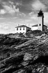 Beavertail Lighthouse Over Rocky Shore In Rhode Island